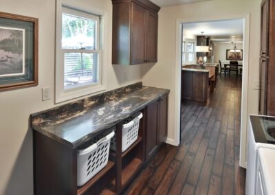 A Modern Kitchen featuring a Washer and Dryer, Showcasing Remodeling Services in Menasha, WI